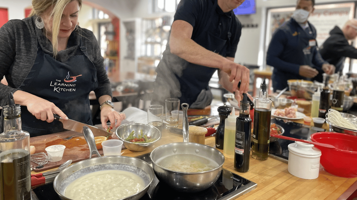 Guests participating in hands-on cooking classes in Cincinnati Guests participating in hands-on cooking classes in Cincinnati