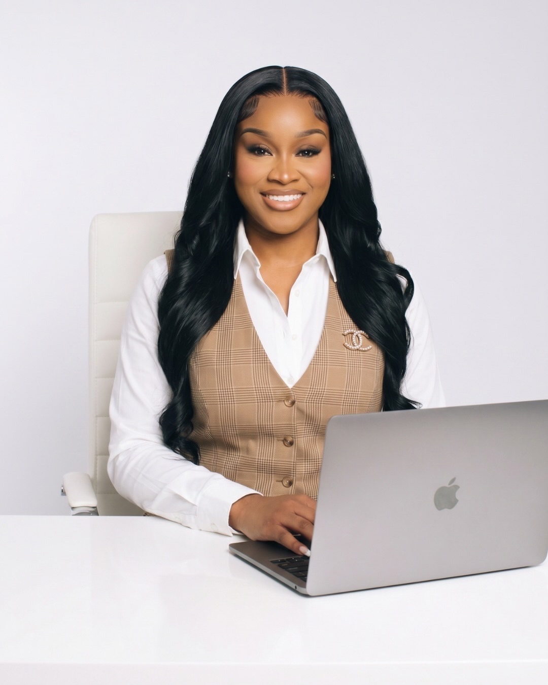 Allure Elite Consulting Lead Strategist at desk
