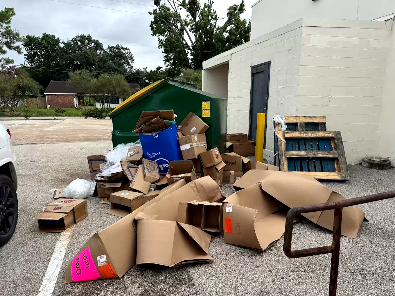 Cardboard and furniture beside a commercial building
