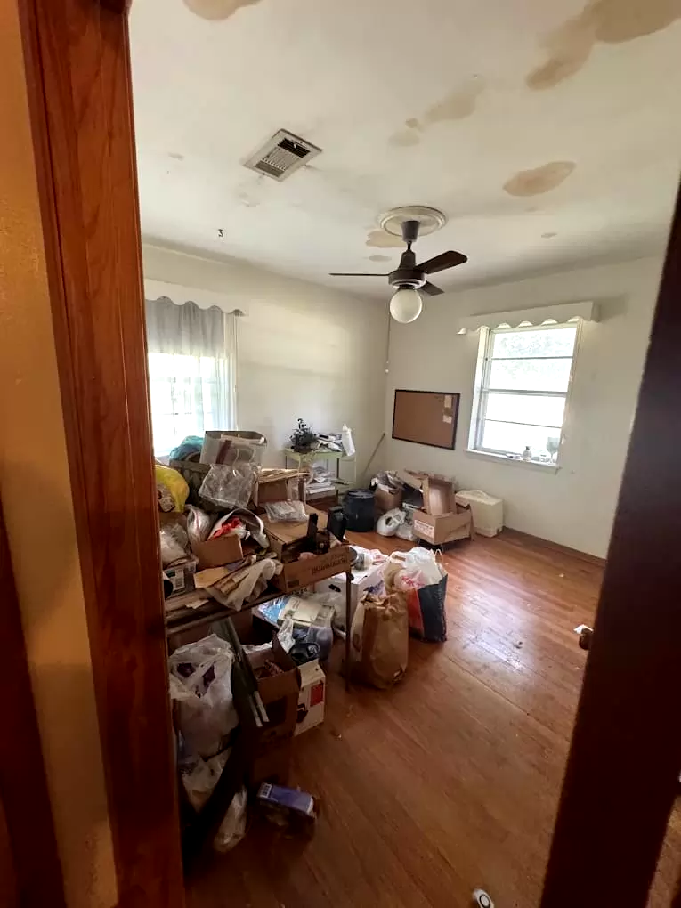 Boxes and household belongings in a living room