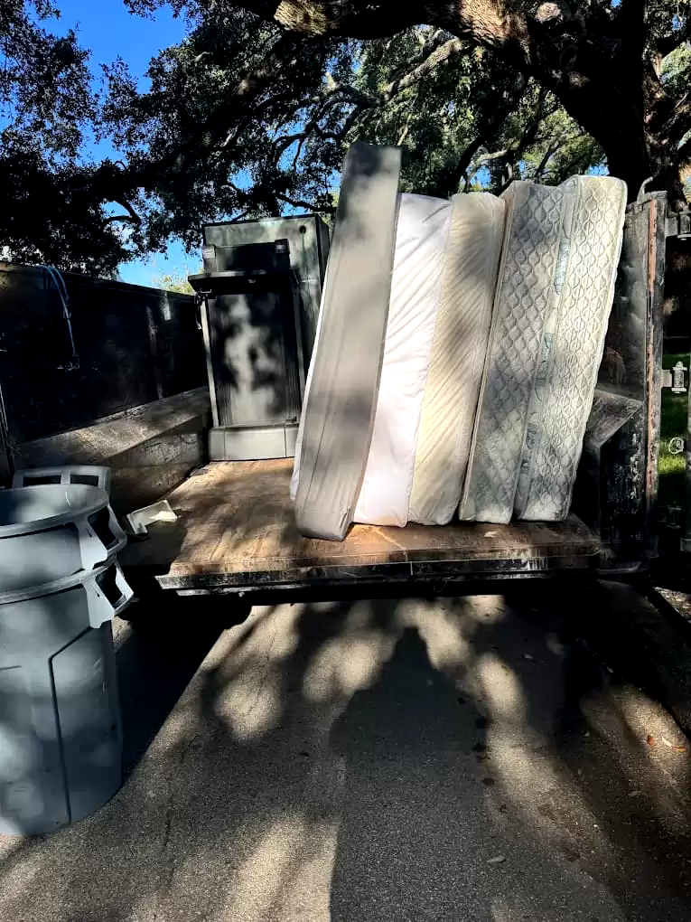 Mattresses loaded upright in a trailer