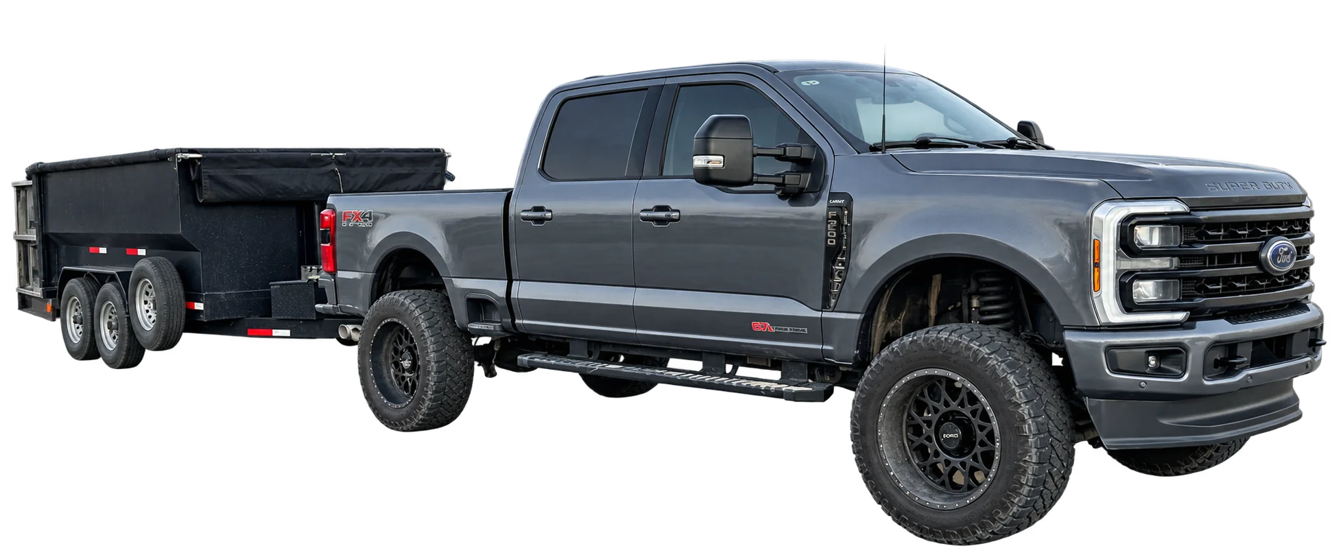 Front-angle view of the Dumpster 55 Crew pickup truck with an attached loaded trailer