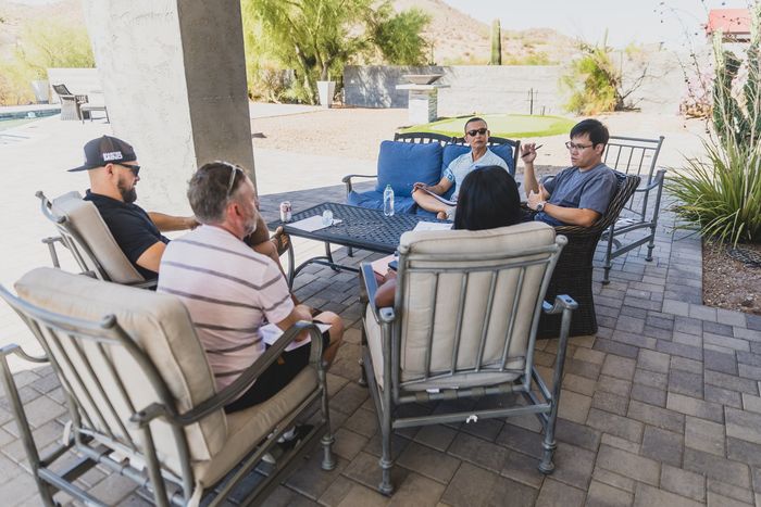 Outdoor small-group conversation on a patio