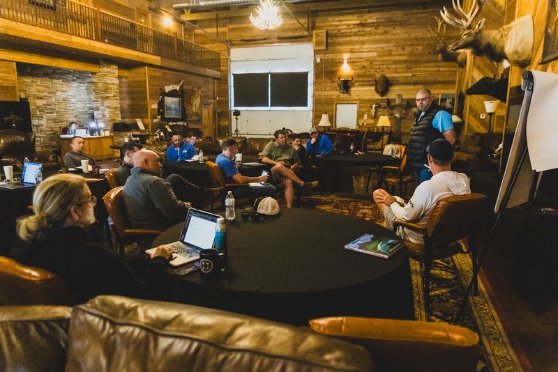 Operators with laptops in a lodge mastermind