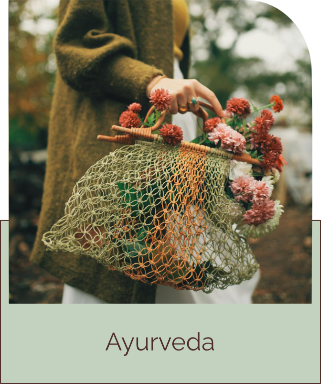 Woman with a crochet bag of flowers and groceries