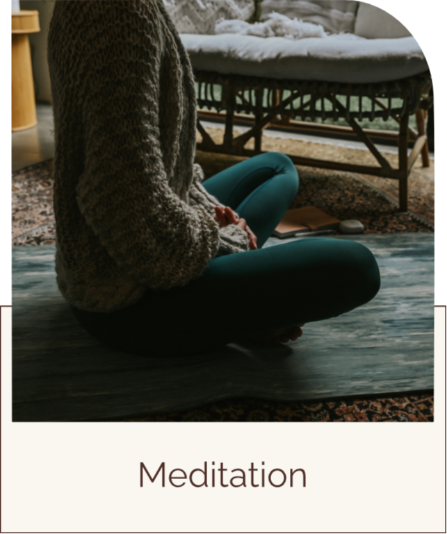 Woman sitting on er yoga mat meditating