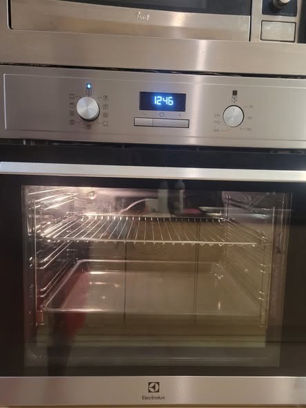 A clean built-in oven with the door closed