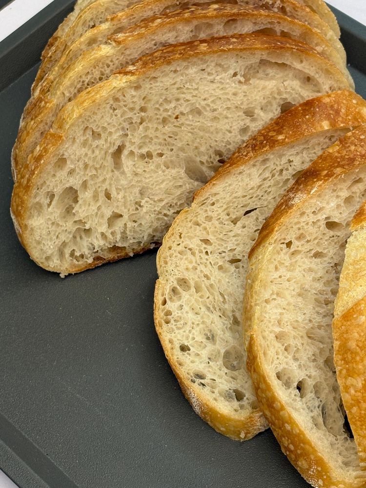 Original sourdough slices showing an open, airy crumb
