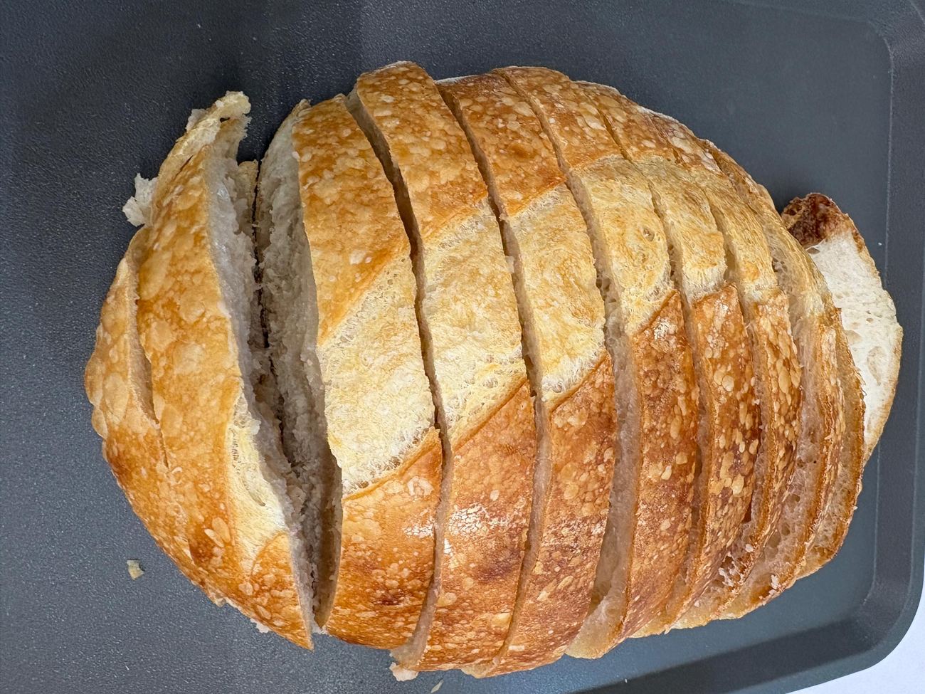 An Original sourdough loaf sliced right through, top down