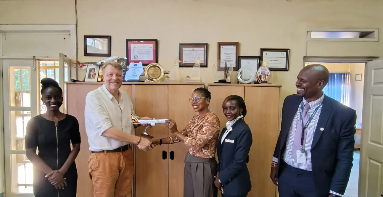 Uganda Airlines team presenting a model aircraft to Mashamba MD Kristjan Erlingsson during a Customer Service Week courtesy visit to the Mashamba office in Kampala, 7 October 2026