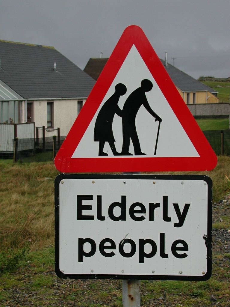 road sign warning of elderly people crossing