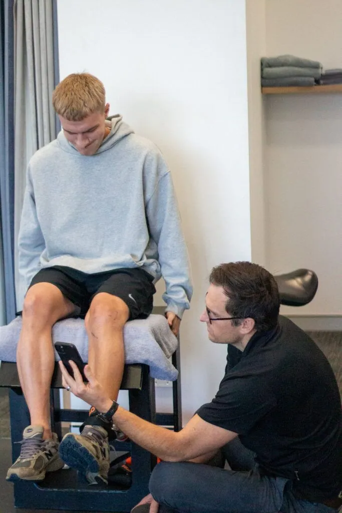 If your child’s been complaining about pain just below their kneecap—especially after running, jumping, or kneeling—this guide should help you make sense of what’s going on and what to do next. What Is Osgood-Schlatter Disease? Osgood-Schlatter is a type of growth plate injury that happens right at the top of the shinbone, at a spot called the tibial tuberosity. That’s where the patellar tendon from the kneecap attaches—and in kids, that area is still forming. It’s softer than adult bone, which makes it more vulnerable to stress. So when a child is active—running around, jumping, kicking—the repeated pull on that area can cause irritation. Over time, that leads to pain and swelling. Some kids will even develop a noticeable bump just below the knee. Why Does It Happen? If your child’s been complaining about pain just below their kneecap—especially after running, jumping, or kneeling—this guide should help you make sense of what’s going on and what to do next. What Is Osgood-Schlatter Disease? Osgood-Schlatter is a type of growth plate injury that happens right at the top of the shinbone, at a spot called the tibial tuberosity. That’s where the patellar tendon from the kneecap attaches—and in kids, that area is still forming. It’s softer than adult bone, which makes it more vulnerable to stress. So when a child is active—running around, jumping, kicking—the repeated pull on that area can cause irritation. Over time, that leads to pain and swelling. Some kids will even develop a noticeable bump just below the knee. Why Does It Happen?