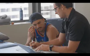Patient discussing knee rehabilitation plan with Gold Coast physiotherapist for recovery after ACL surgery.
