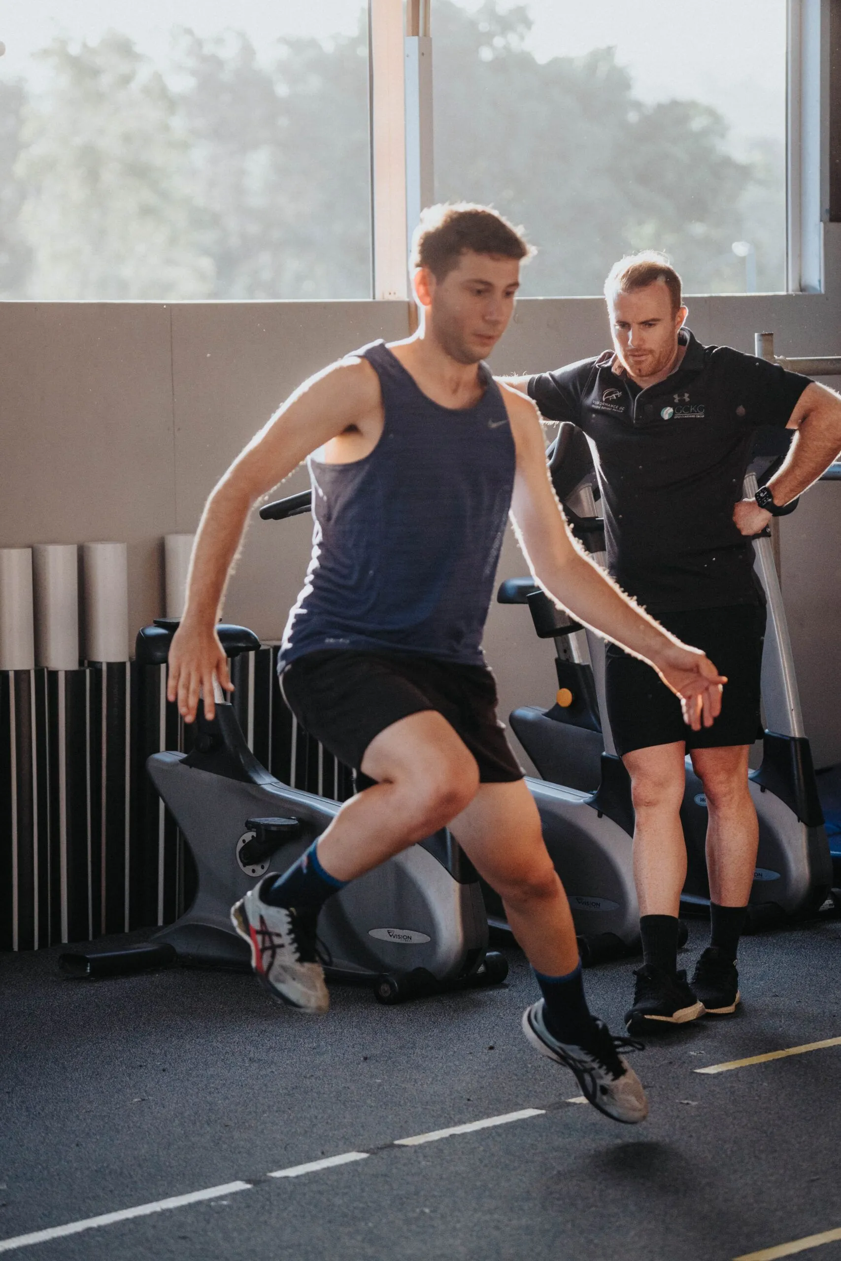 Gold Coast physiotherapist guiding patient through knee rehabilitation exercises post-ACL reconstruction surgery.