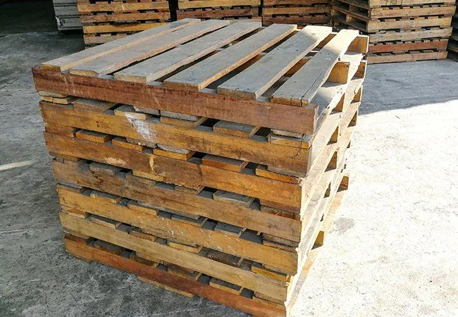Tall stack of pallets in the yard