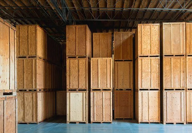 Tall wood crates in a warehouse