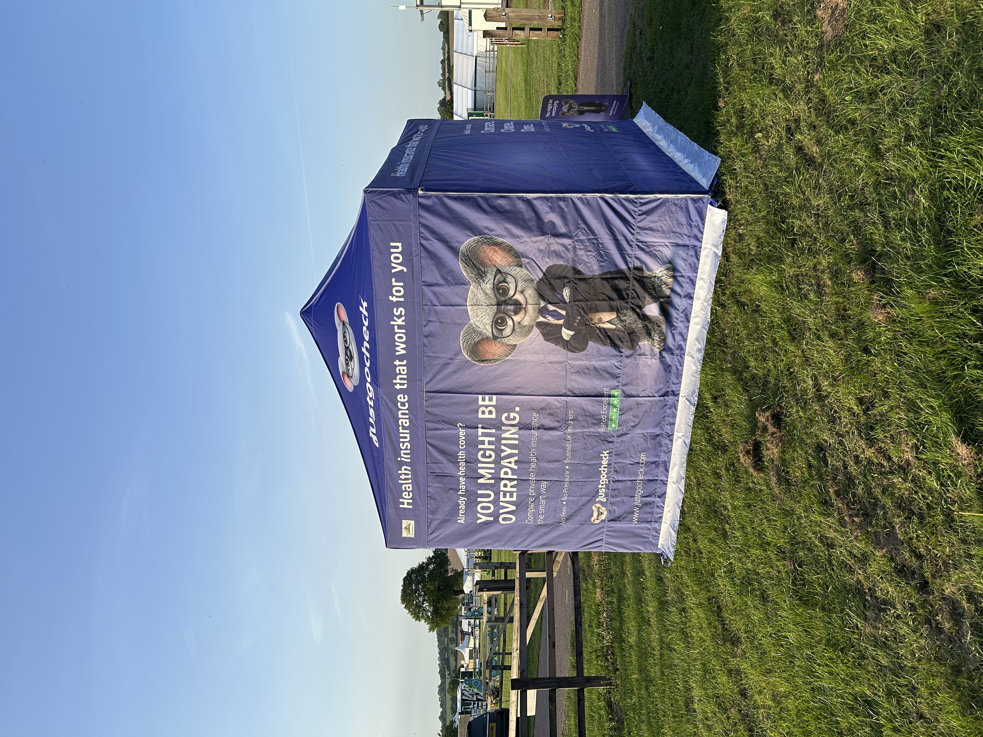 Just Go Check branded event stand with Kevin the Koala