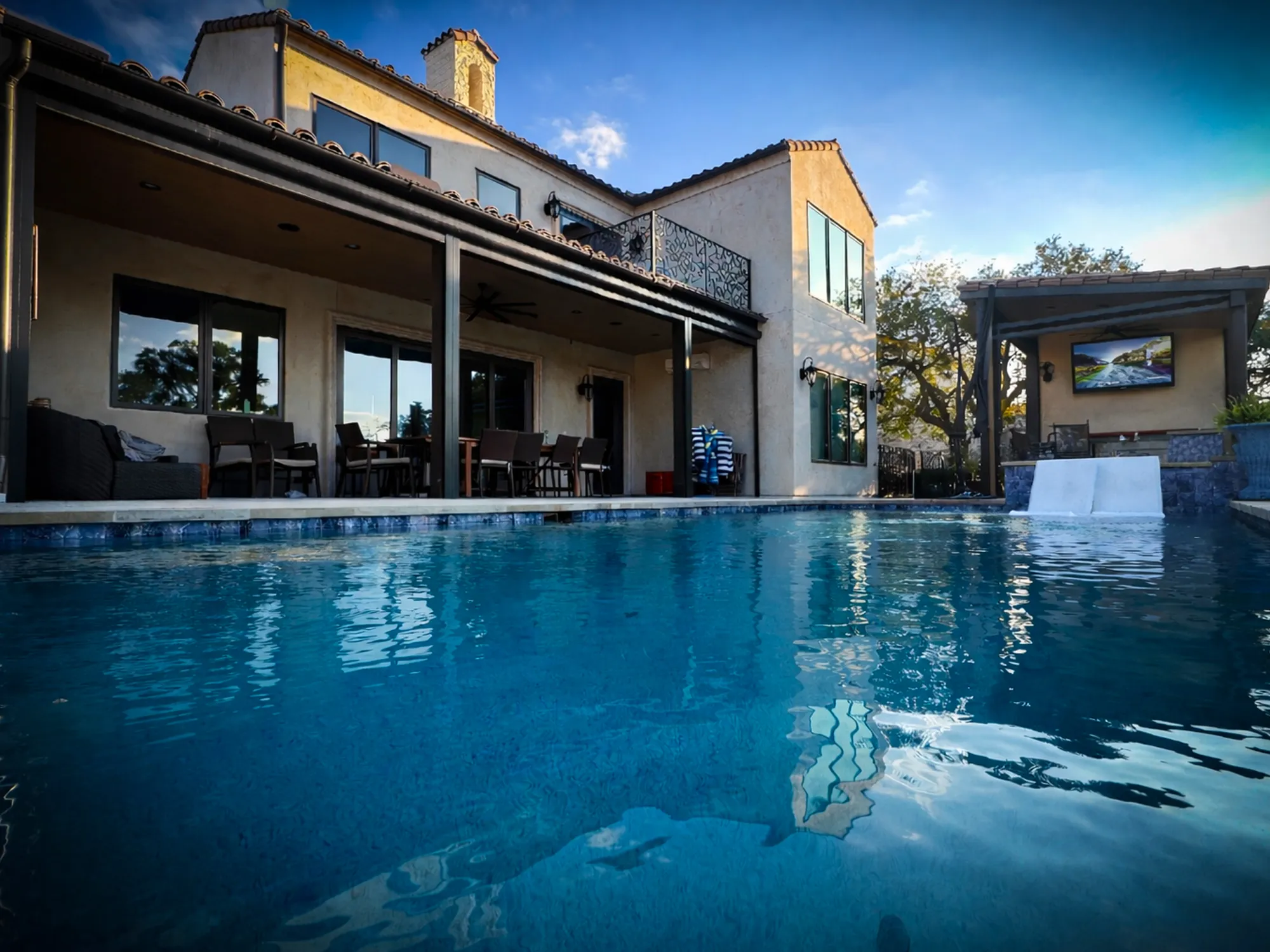 Luxury swimming pool at sunset