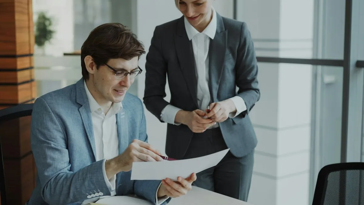 Two colleagues reviewing a document in an office