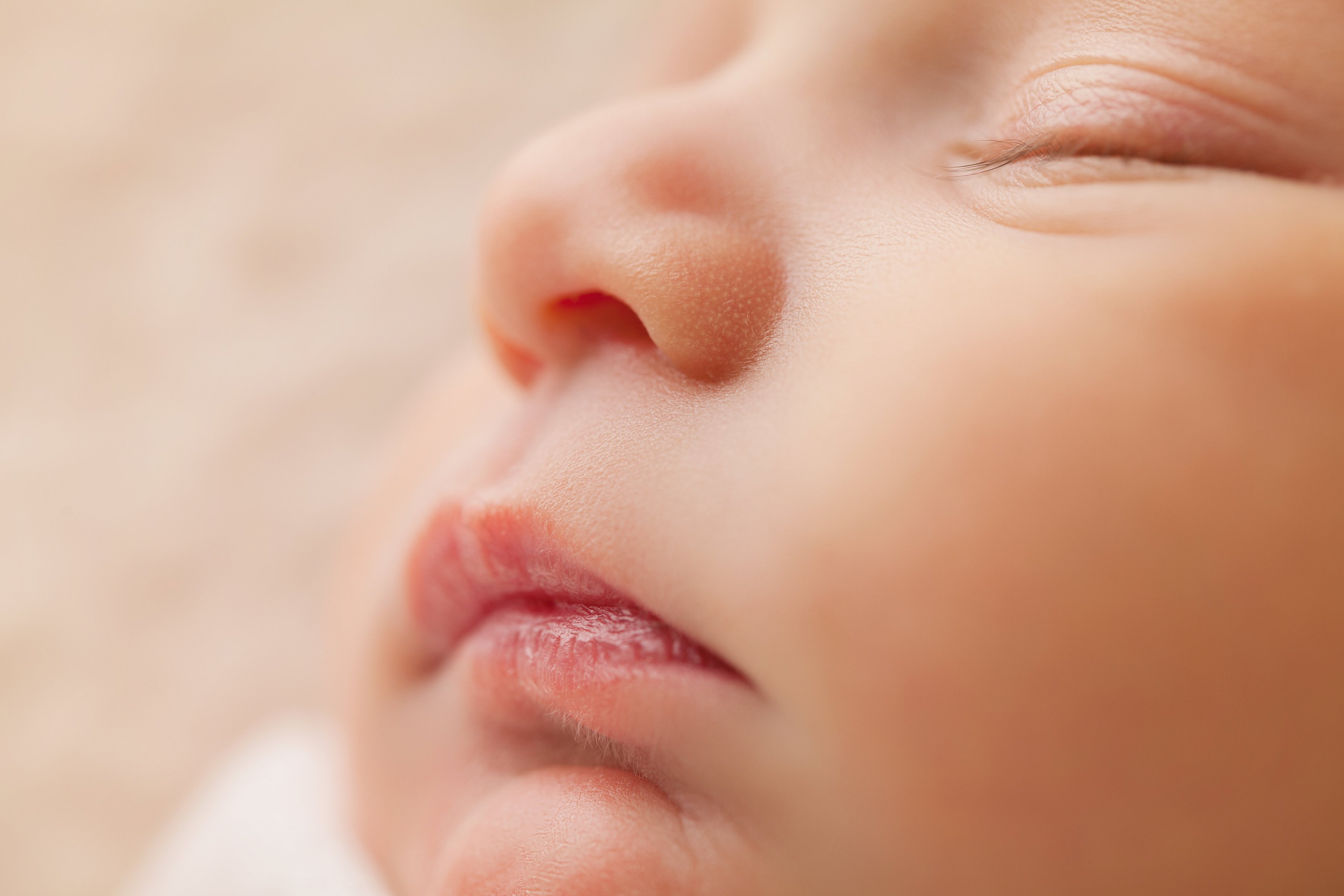 Close-up of a sleeping newborn's face