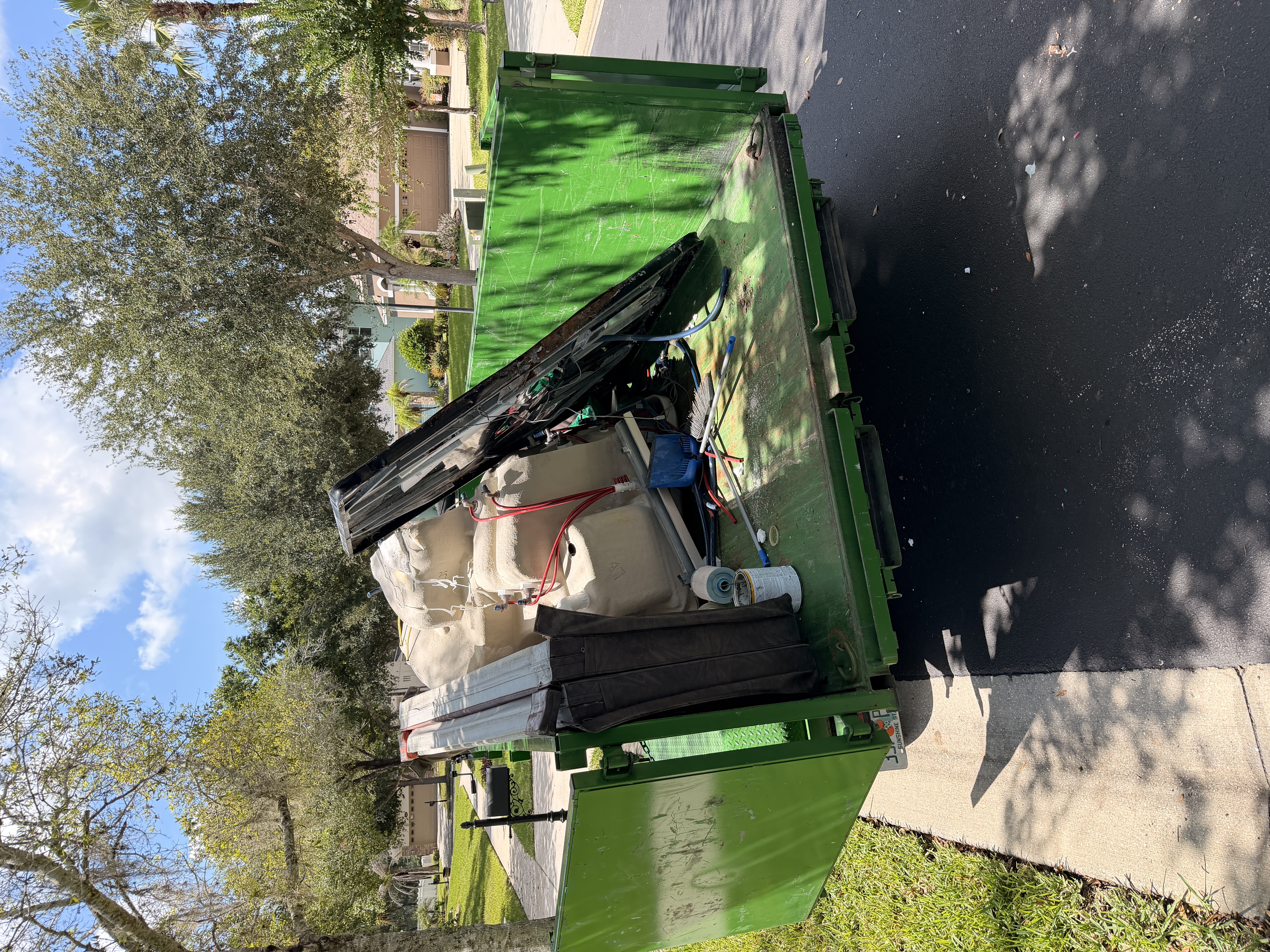 Lift & Load Hauling crew on a junk removal job in Lakeland, FL