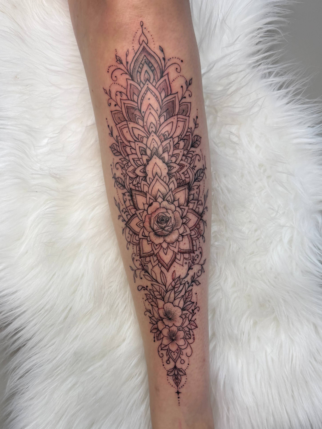 Ornamental mandala fine-line tattoo detail by XXII Ink