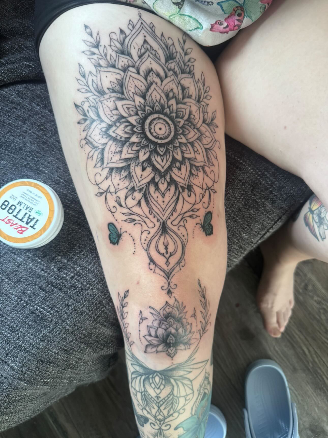 Ornamental mandala thigh tattoo by XXII Ink