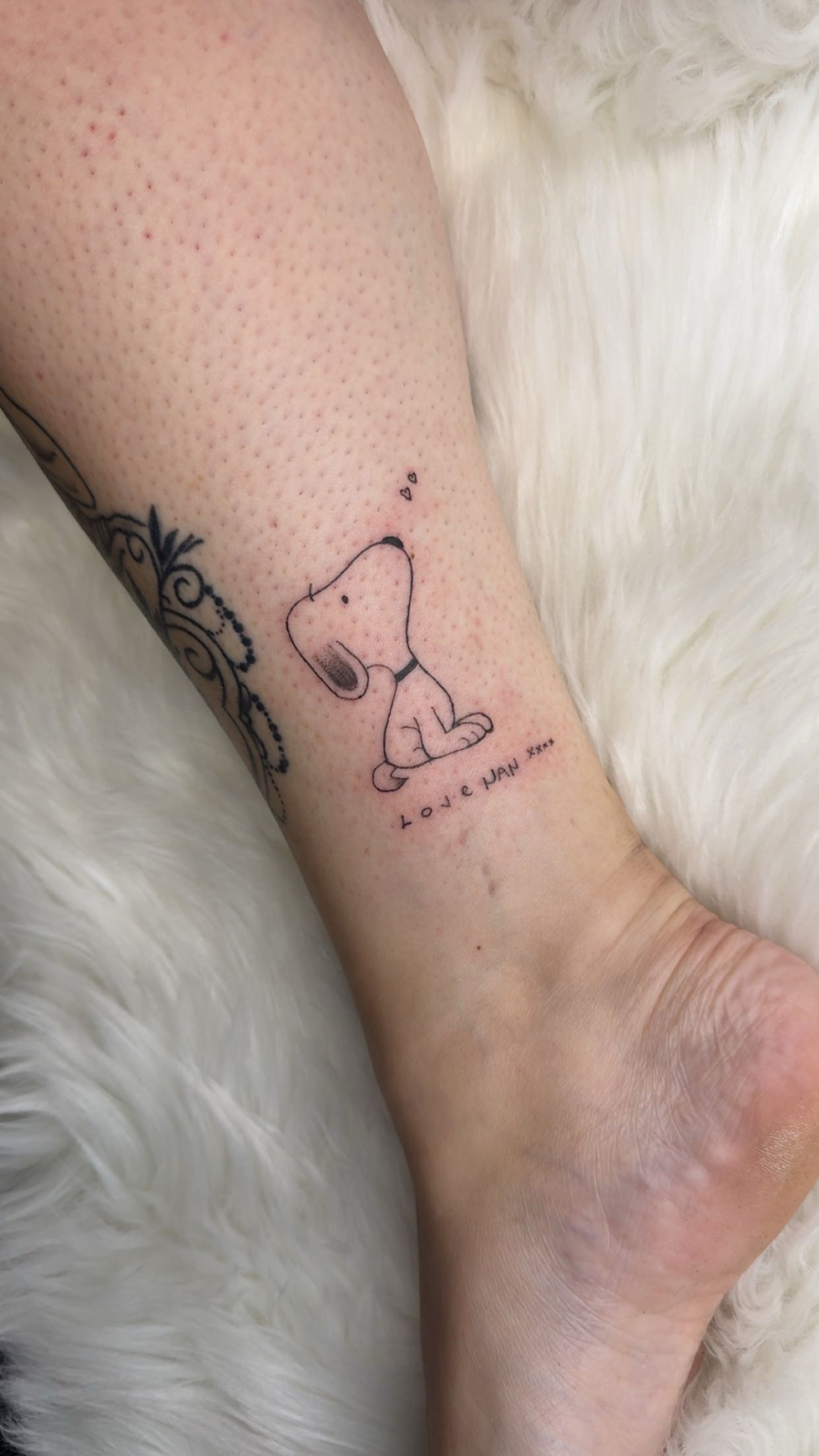 Fine-line character tattoo by XXII Ink