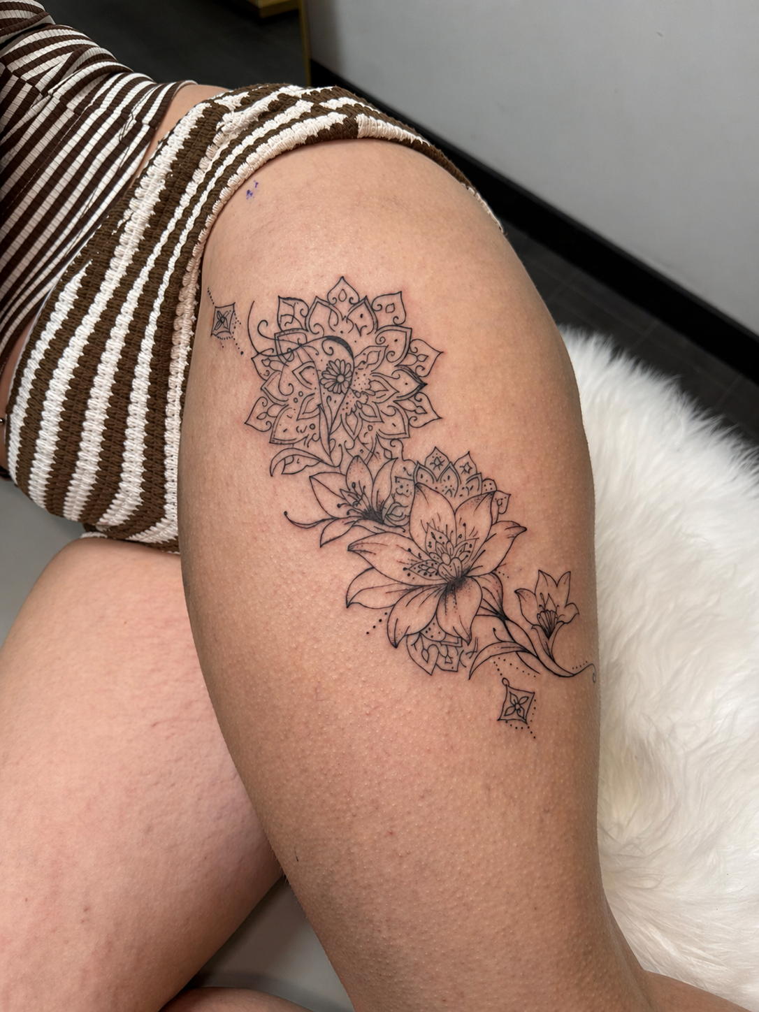 Botanical fine-line tattoo by XXII Ink