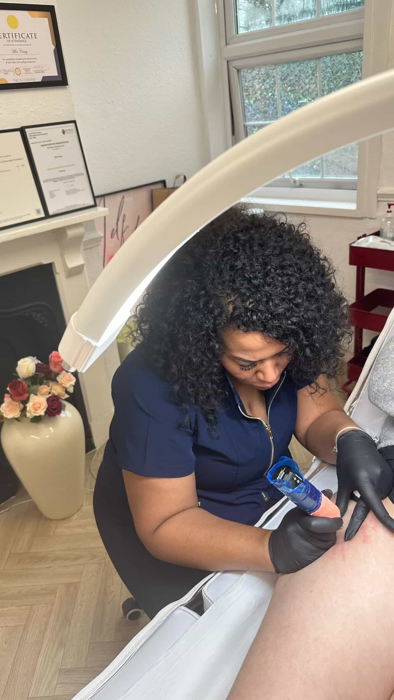 Natalie performing an Inkless treatment by XXII Ink