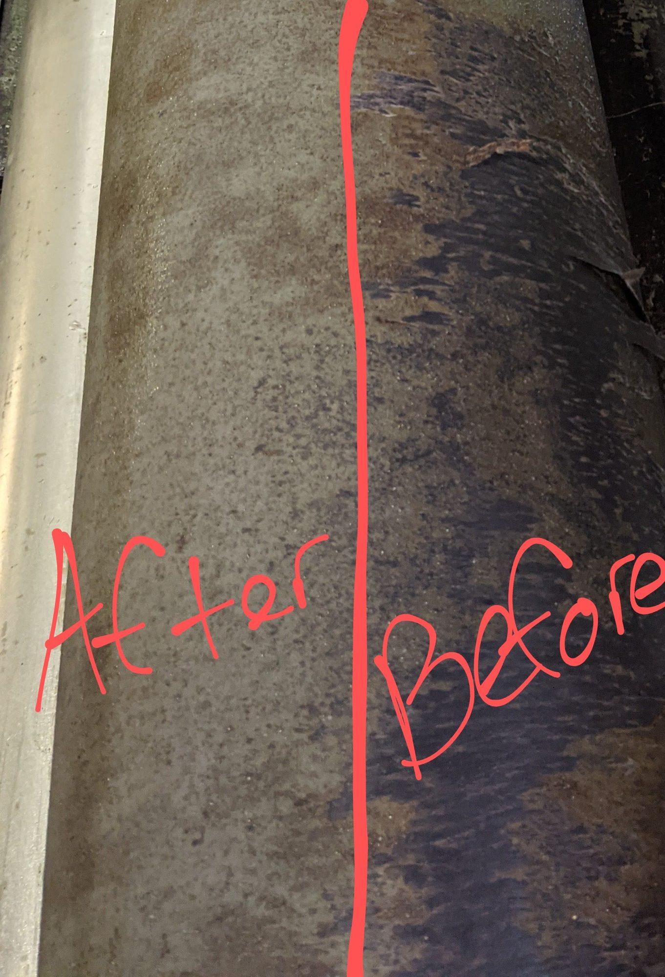 Production roller half cleaned, showing before and after