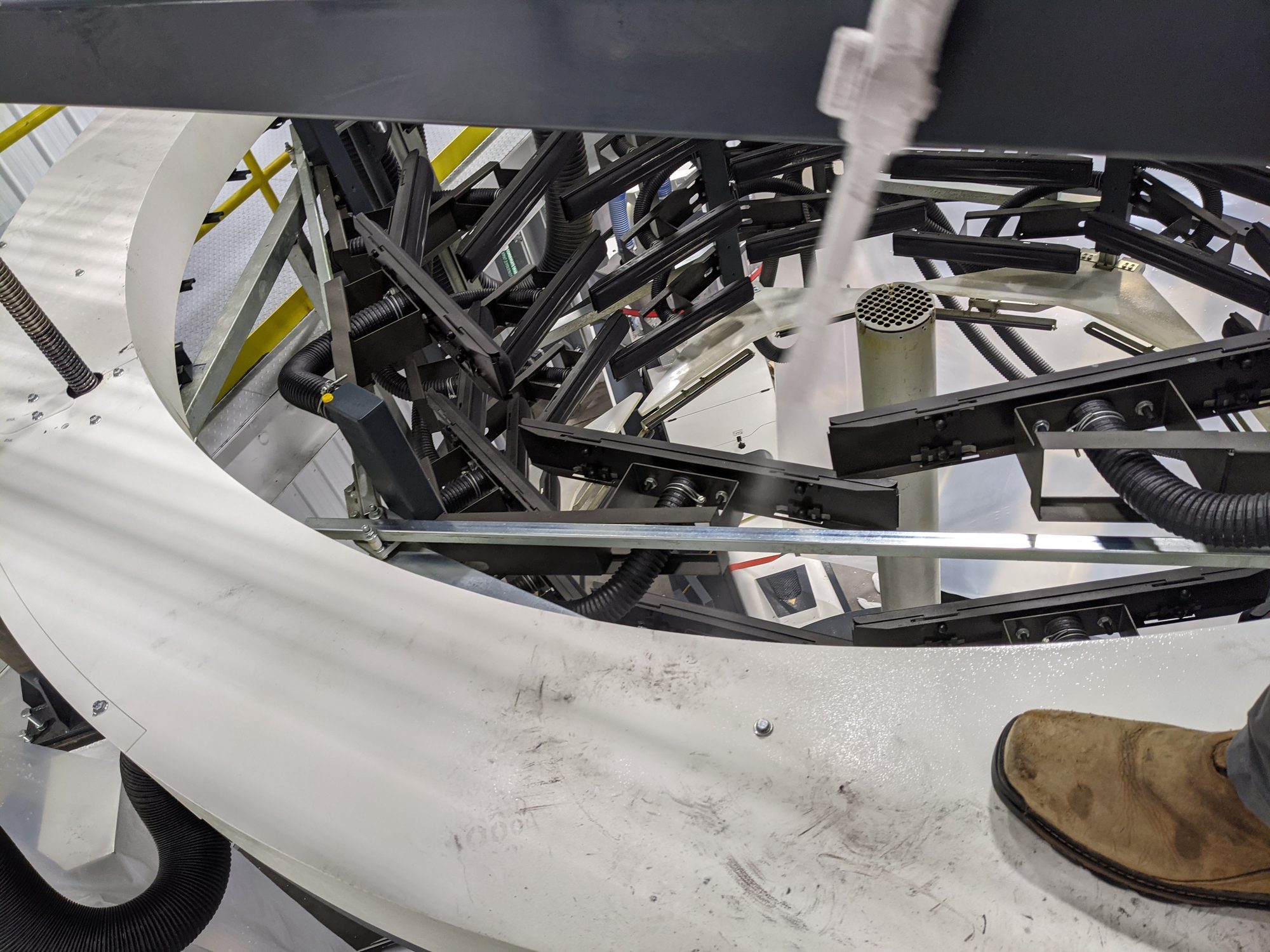 Close view of the CO2 stream hitting the scuffed ring of a film line's rotating platform.