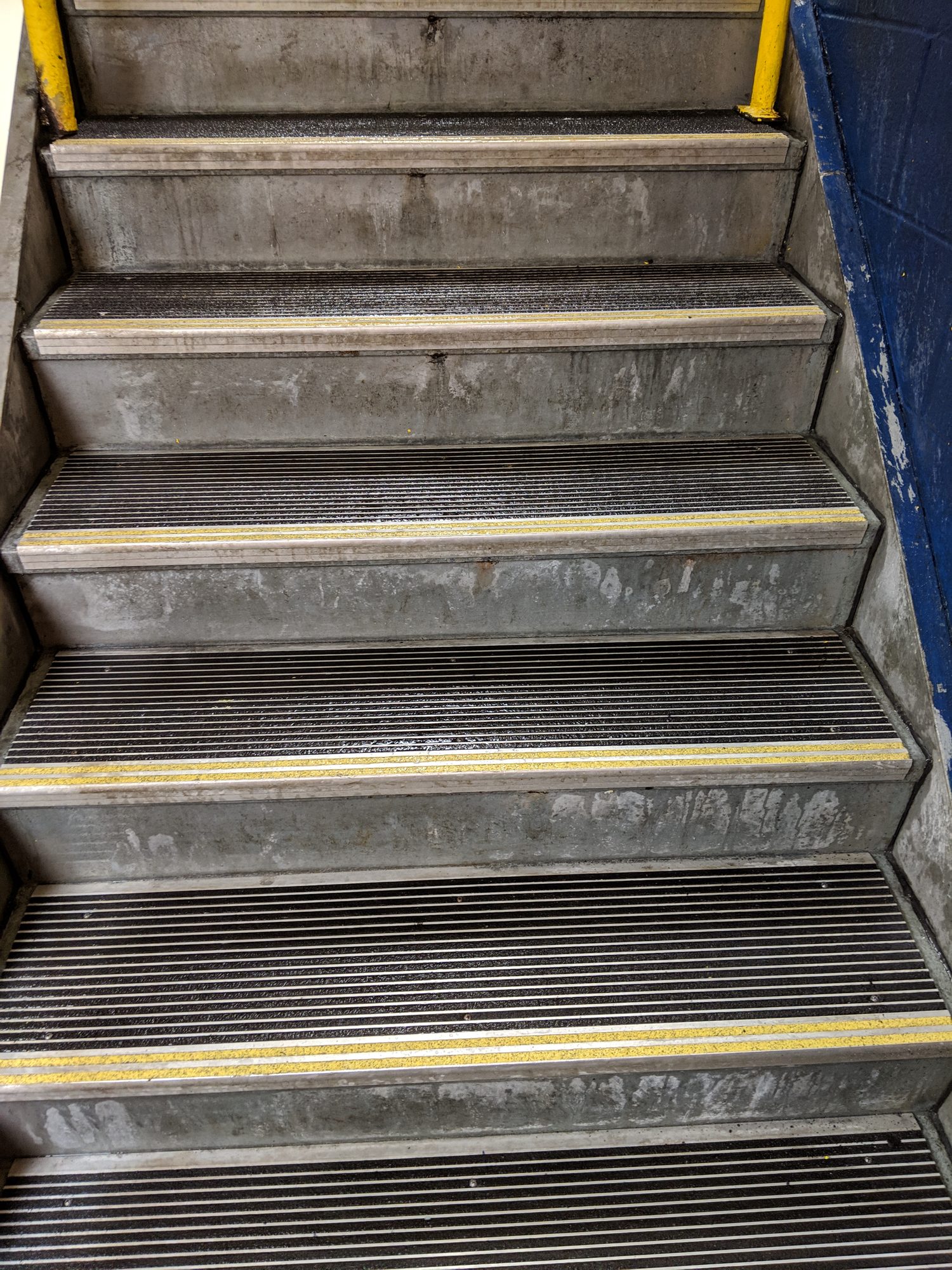 After: the same stair treads washed down to bare grip and clean nosing.