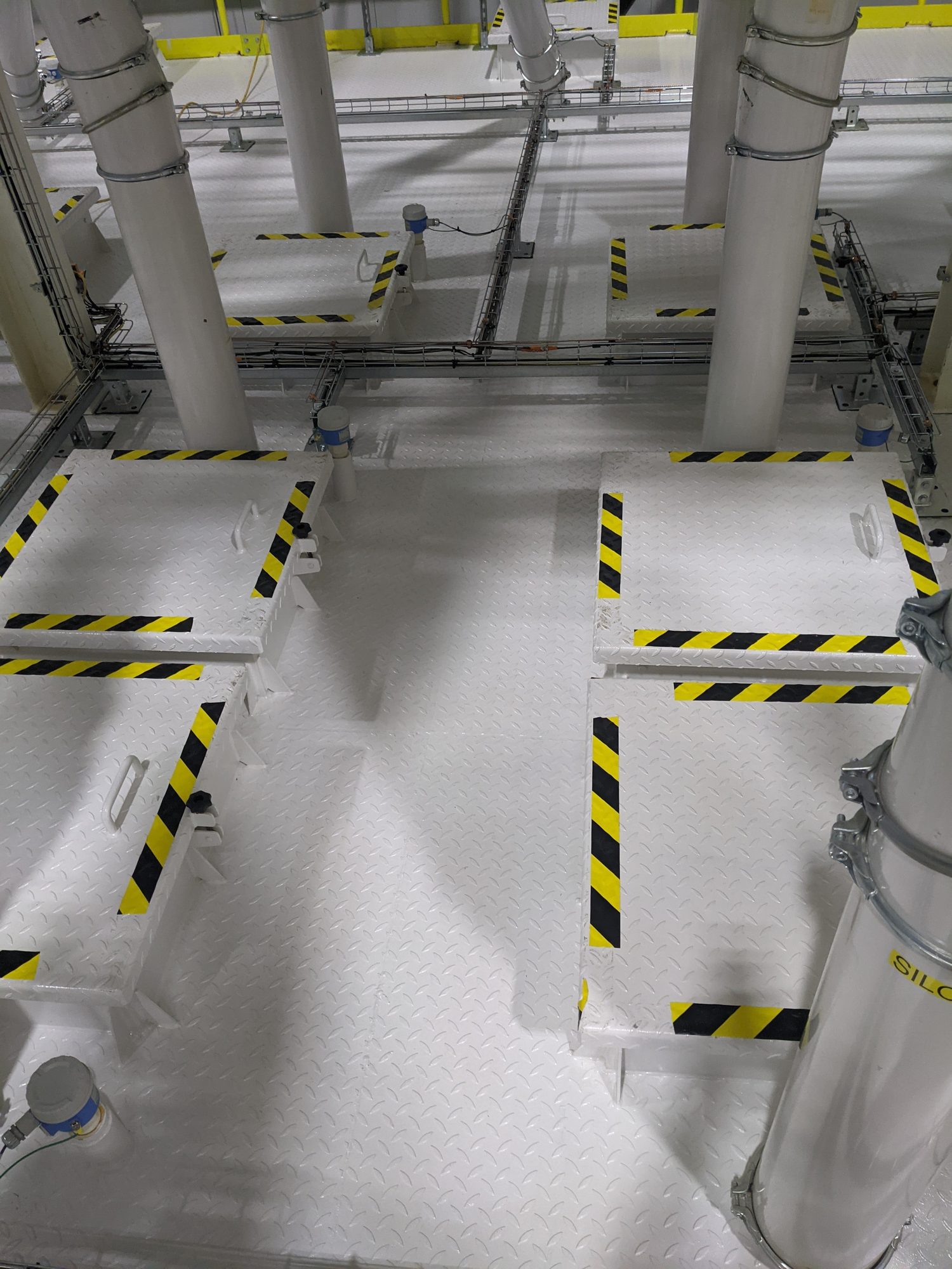 Silo-room floor plates and safety striping wiped clean before startup.