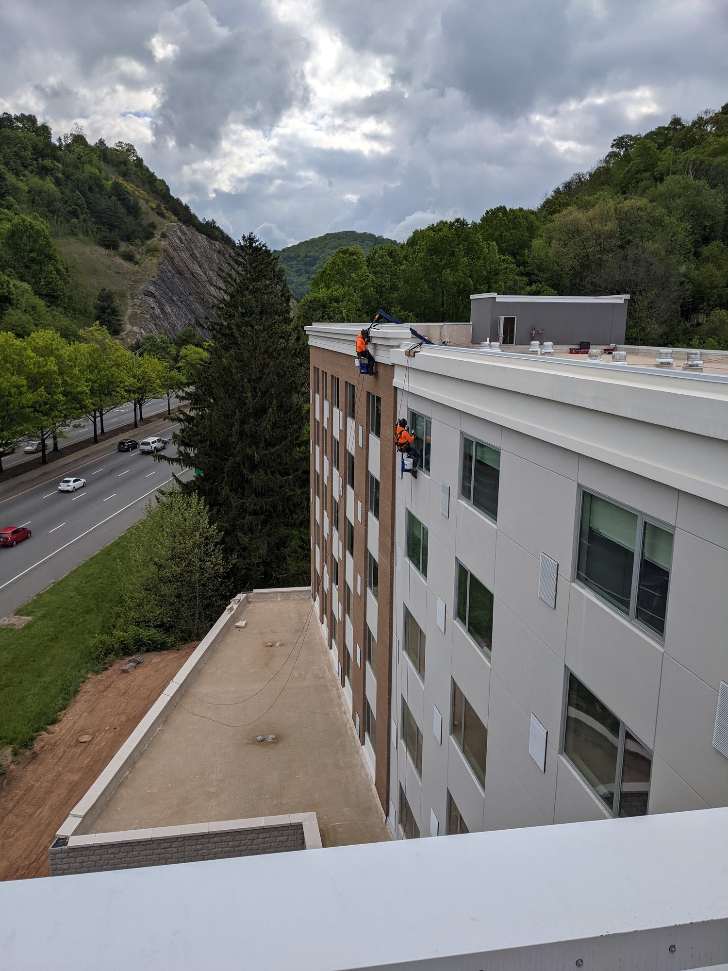 Rope access cleaning facade glass