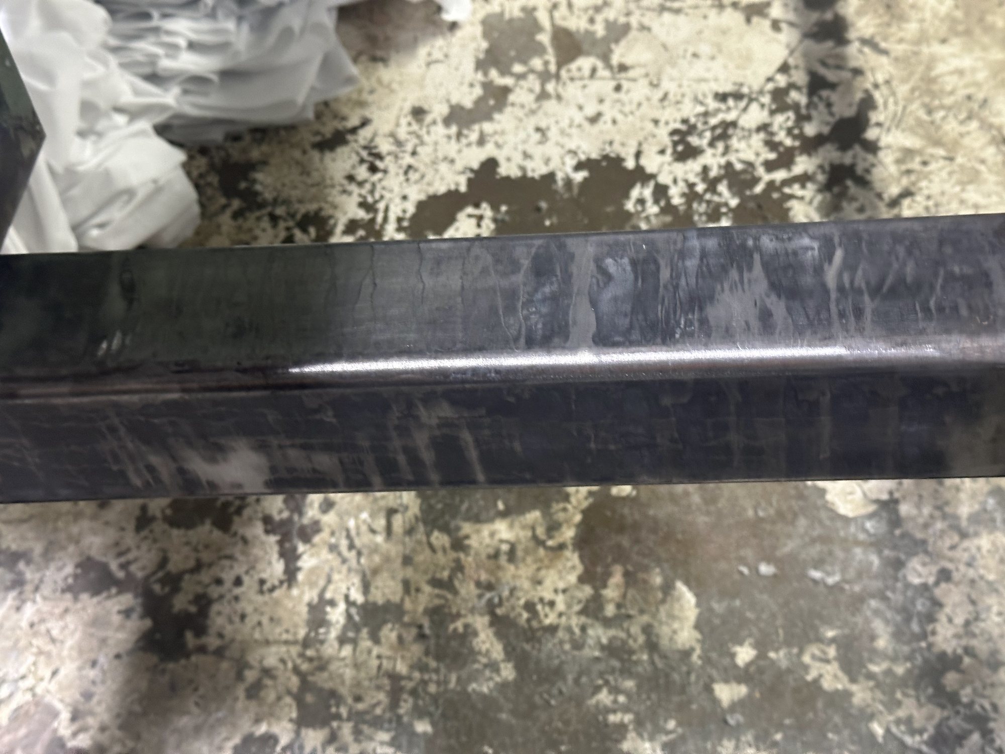 The same steel beam after laser cleaning, residue gone and down to dark bare metal.