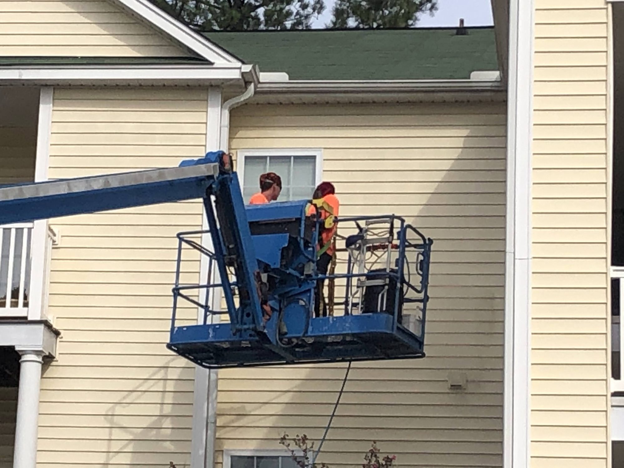 Cleaning at a balcony from outside, so no crew goes through a resident's apartment.