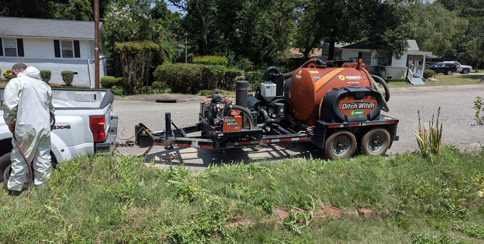 Clean Metro trailer hydrovac staged at the curb for a contaminated soil job