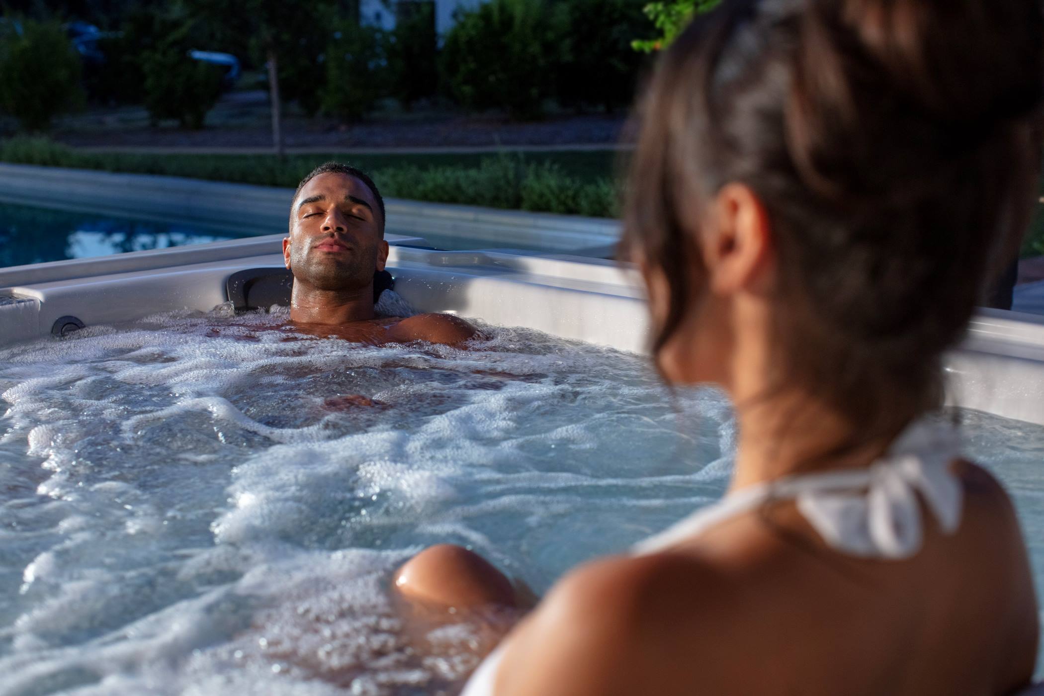 Couple relaxing in Jacuzzi® Hot Tub
