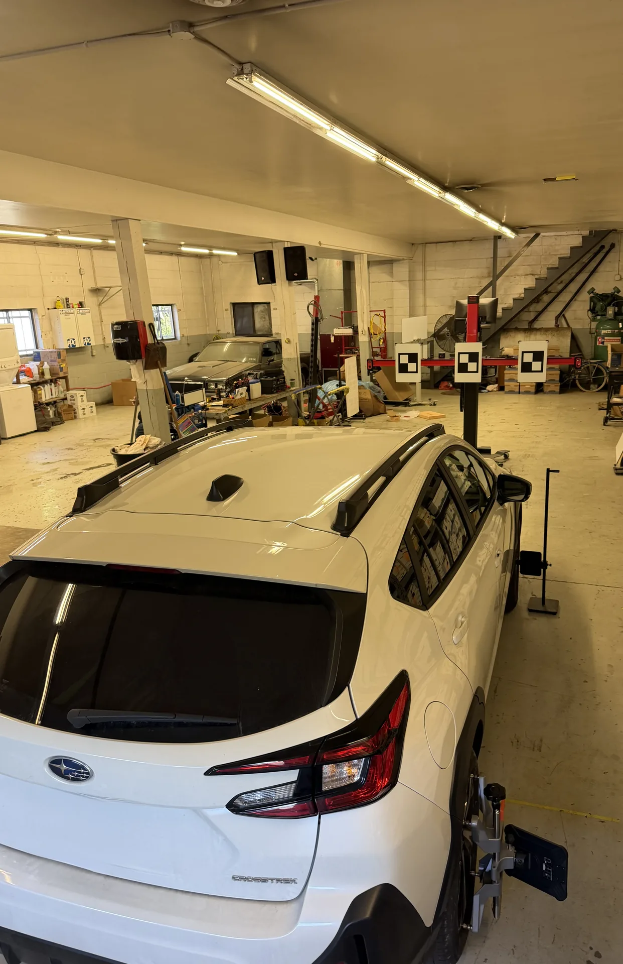 Black Audi Q5 undergoing ADAS calibration with diagnostic monitors at Site Auto Glass Co. shop in Lehighton, PA