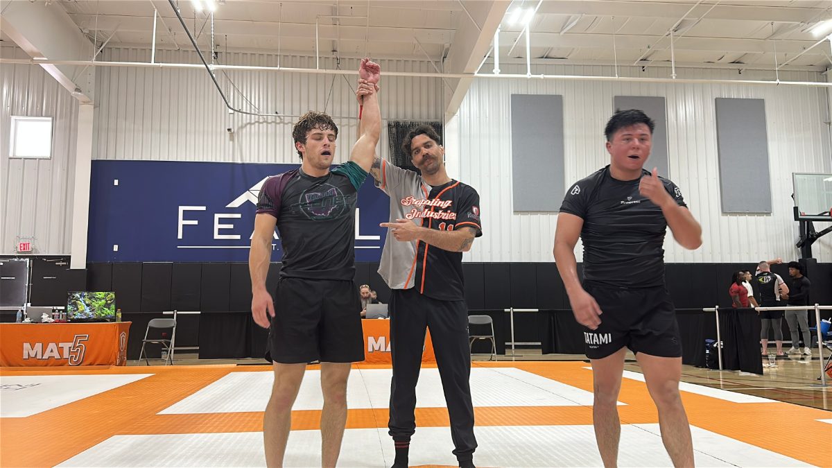 Scott getting his hand raised after winning gold in his division