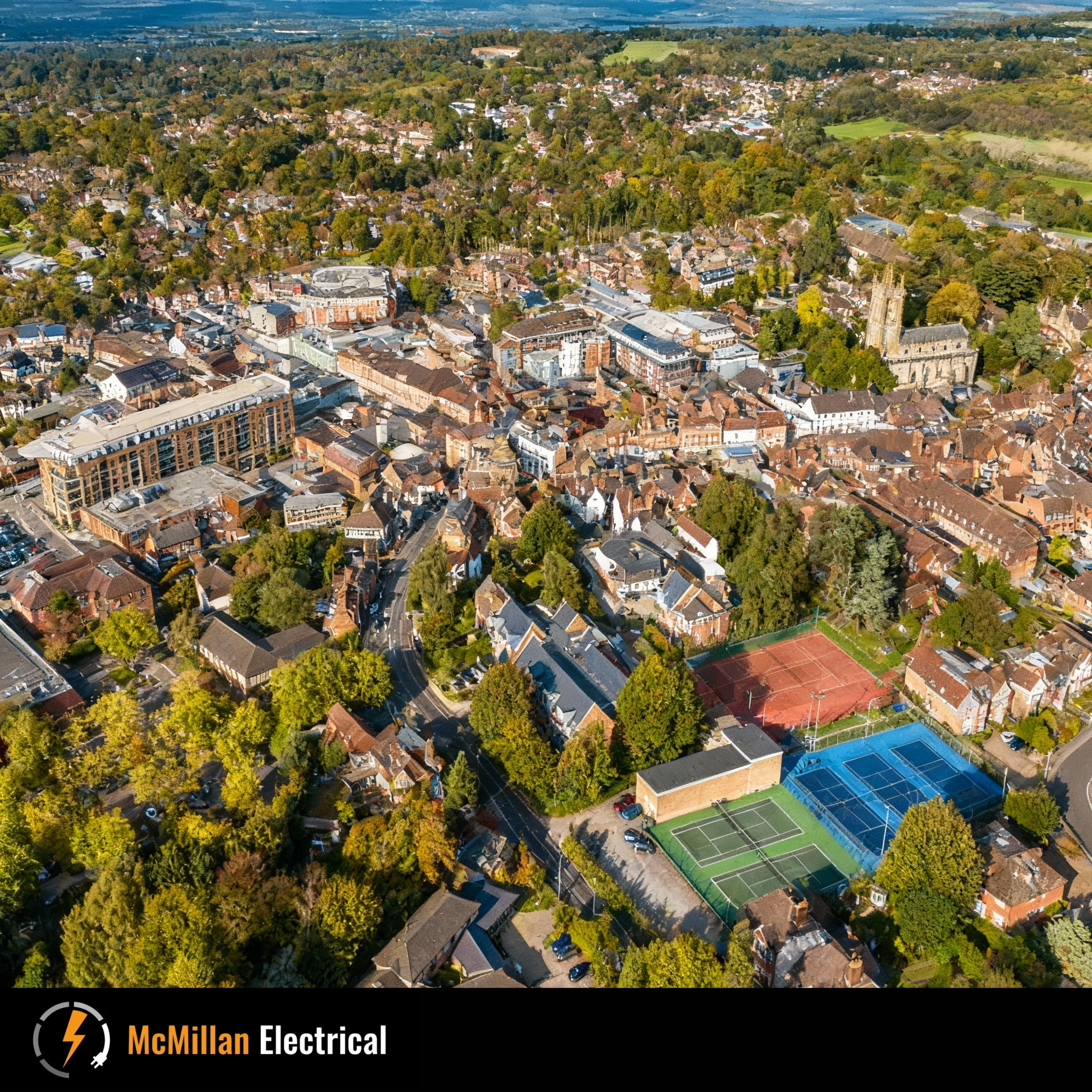 Aerial view of East Grinstead city showcasing the area served by McMillan Electrical, NICEIC-approved electricians for installations, repairs, and EICR testing.