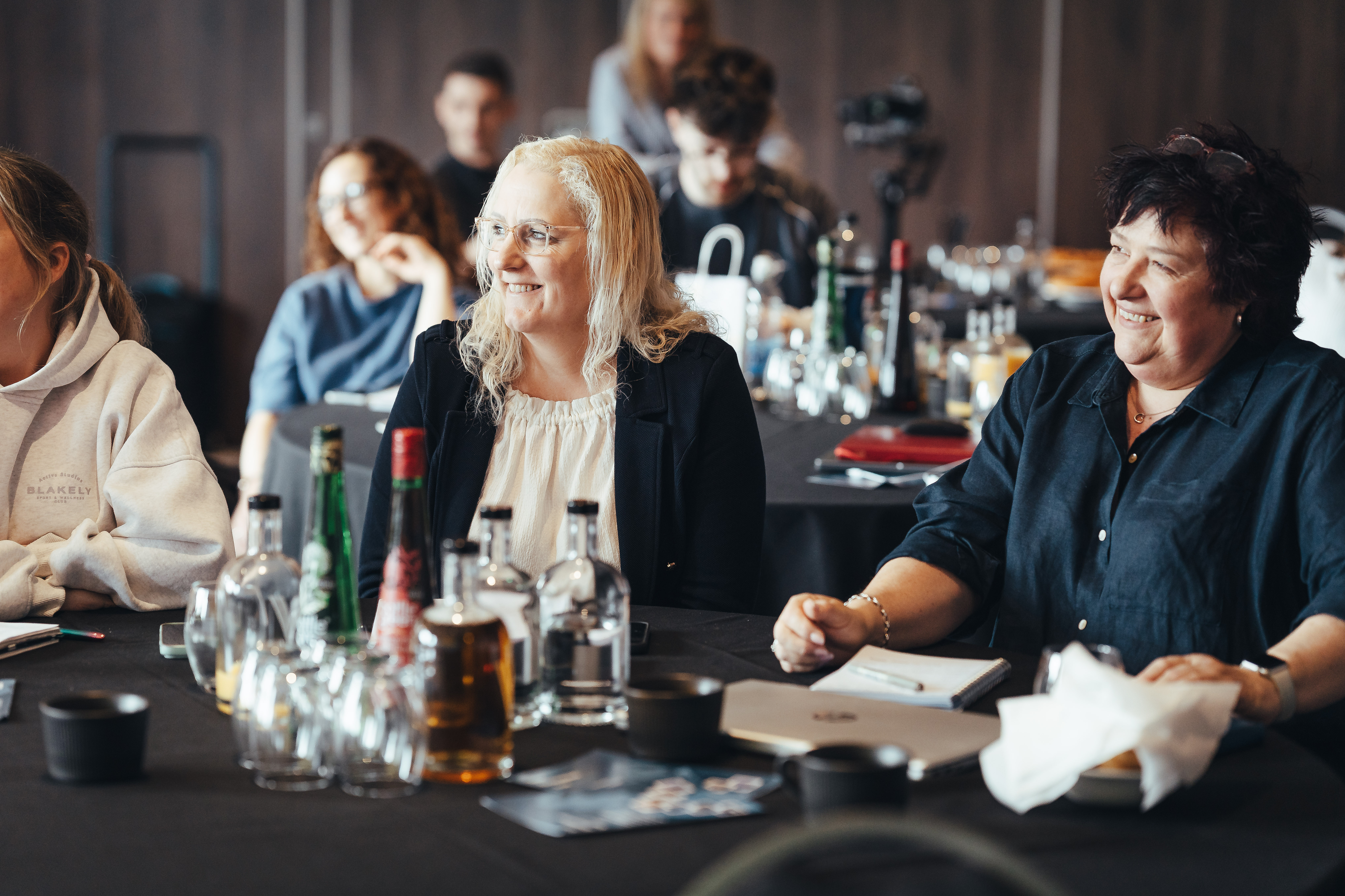 Cleaning business owners listening and taking notes at the TCM event