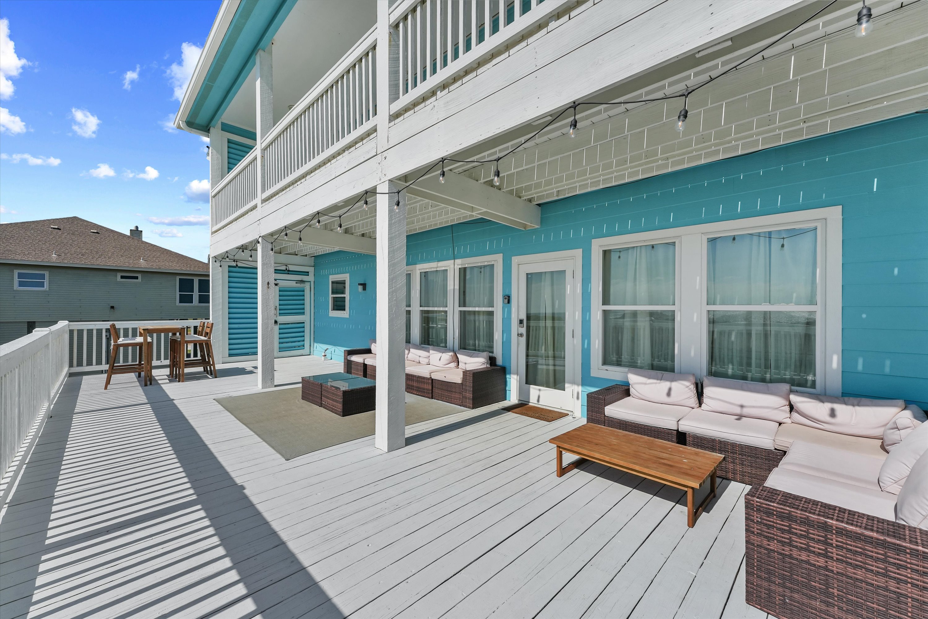 Outdoor deck with seating and Gulf views