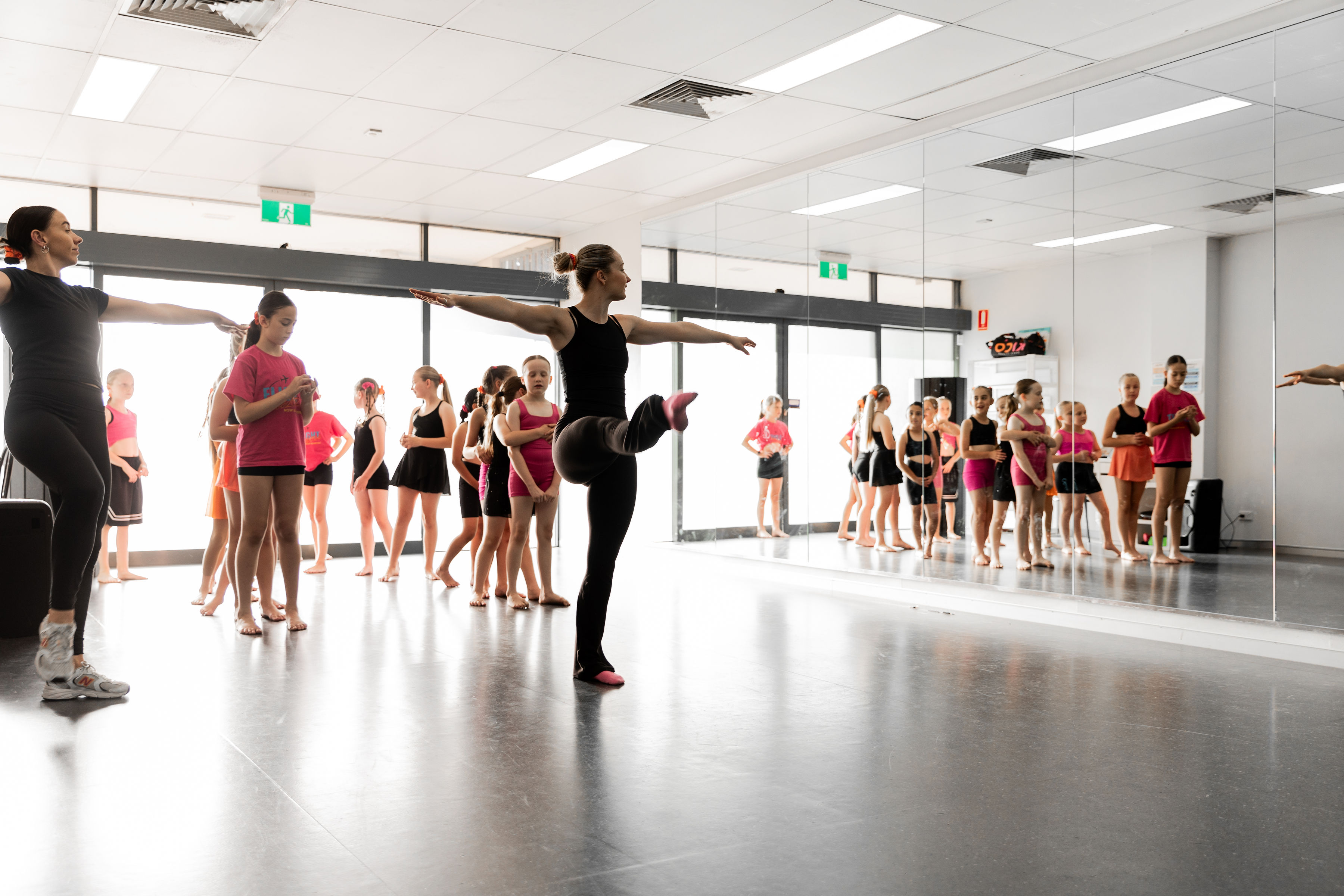 Dance teacher demonstrating technique to students during a class at KICO Dance Studios in Bargo NSW.