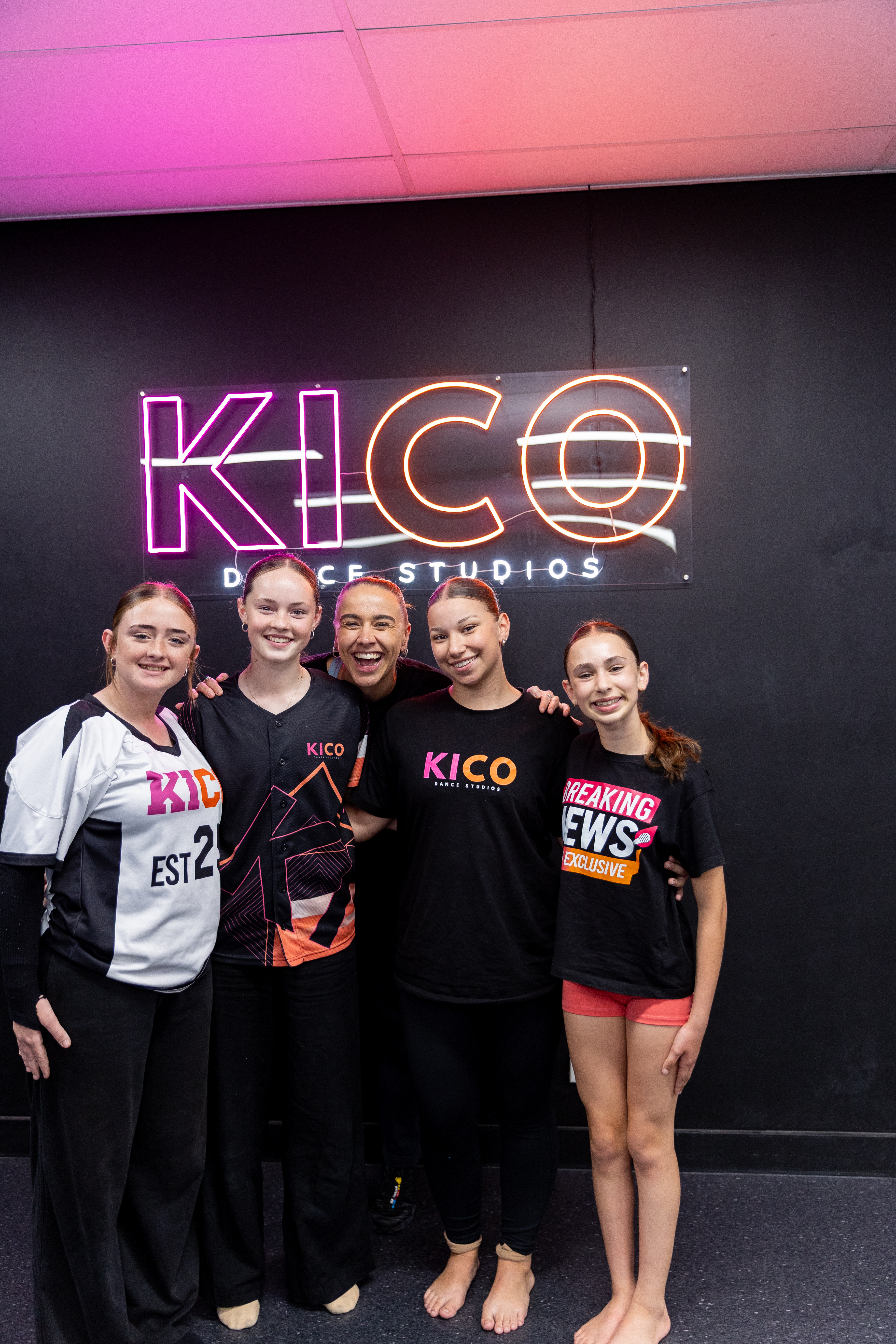 Two Year 7 students high-fiving and laughing during dance class at KICO Dance Studios in Bargo, celebrating connection, confidence, and joy through kids dance programs.