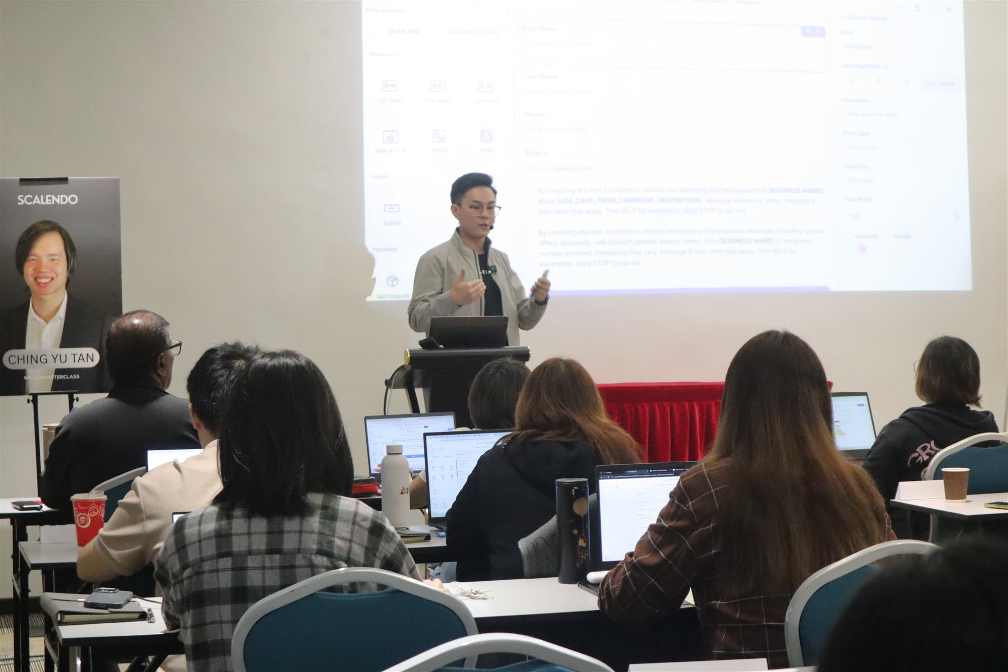 Ethan Foo giving a live website and CRM demo to a workshop class