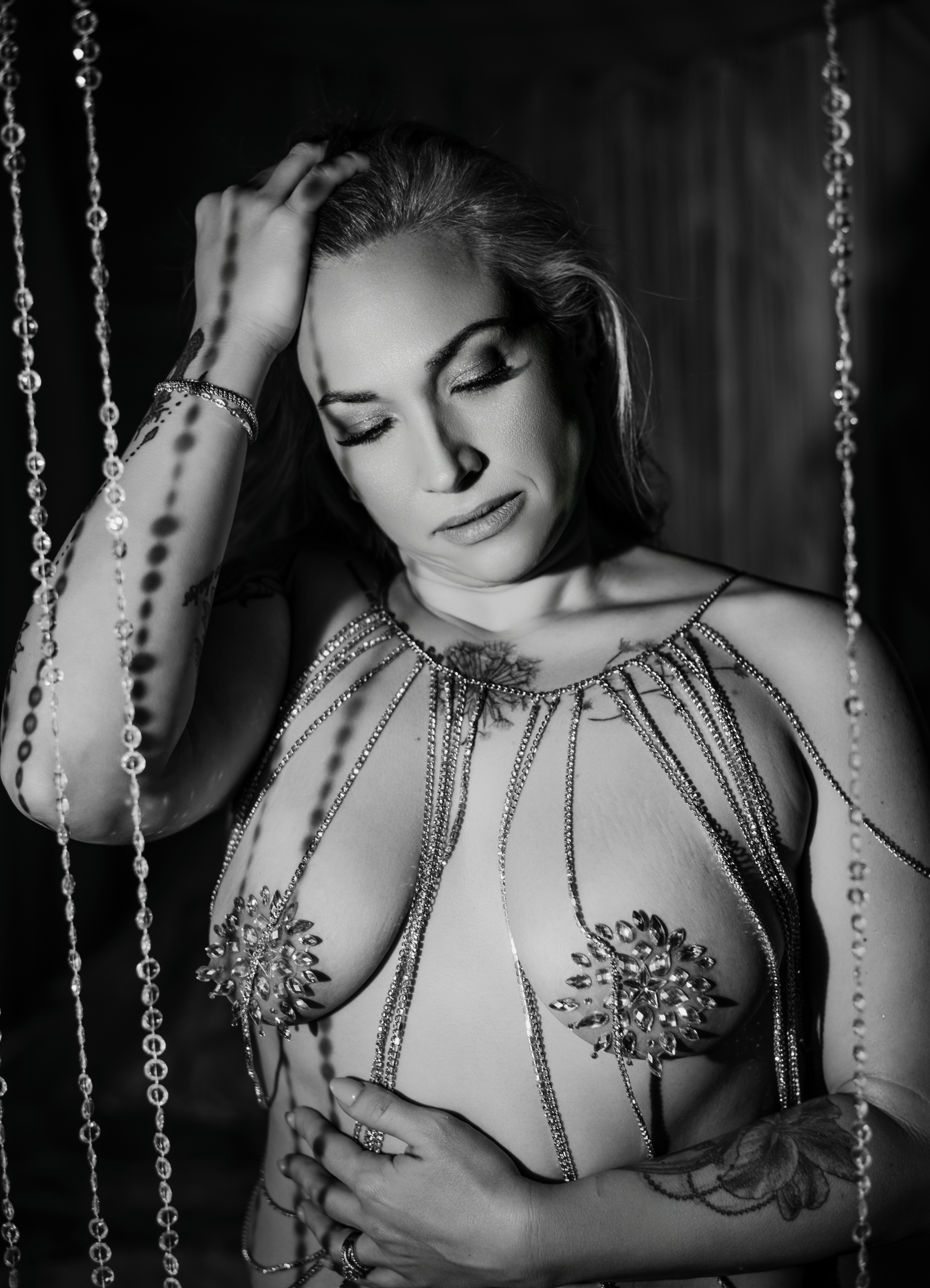 Elegant boudoir photography showcasing body chain accent on female form in Atlanta.