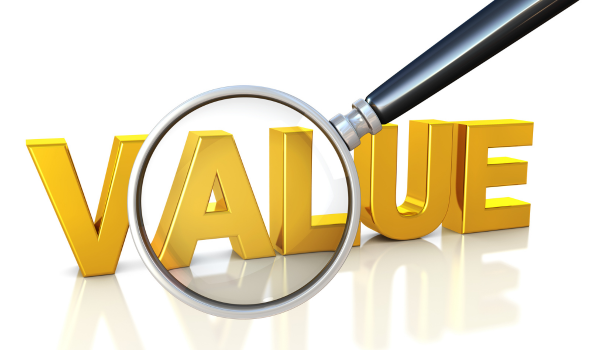 Real estate agent reviewing comparable sales and market data to determine home value Real estate agent reviewing comparable sales and market data to determine home value