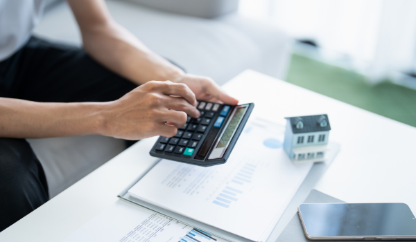 Professional real estate photographer capturing interior photos of a staged home